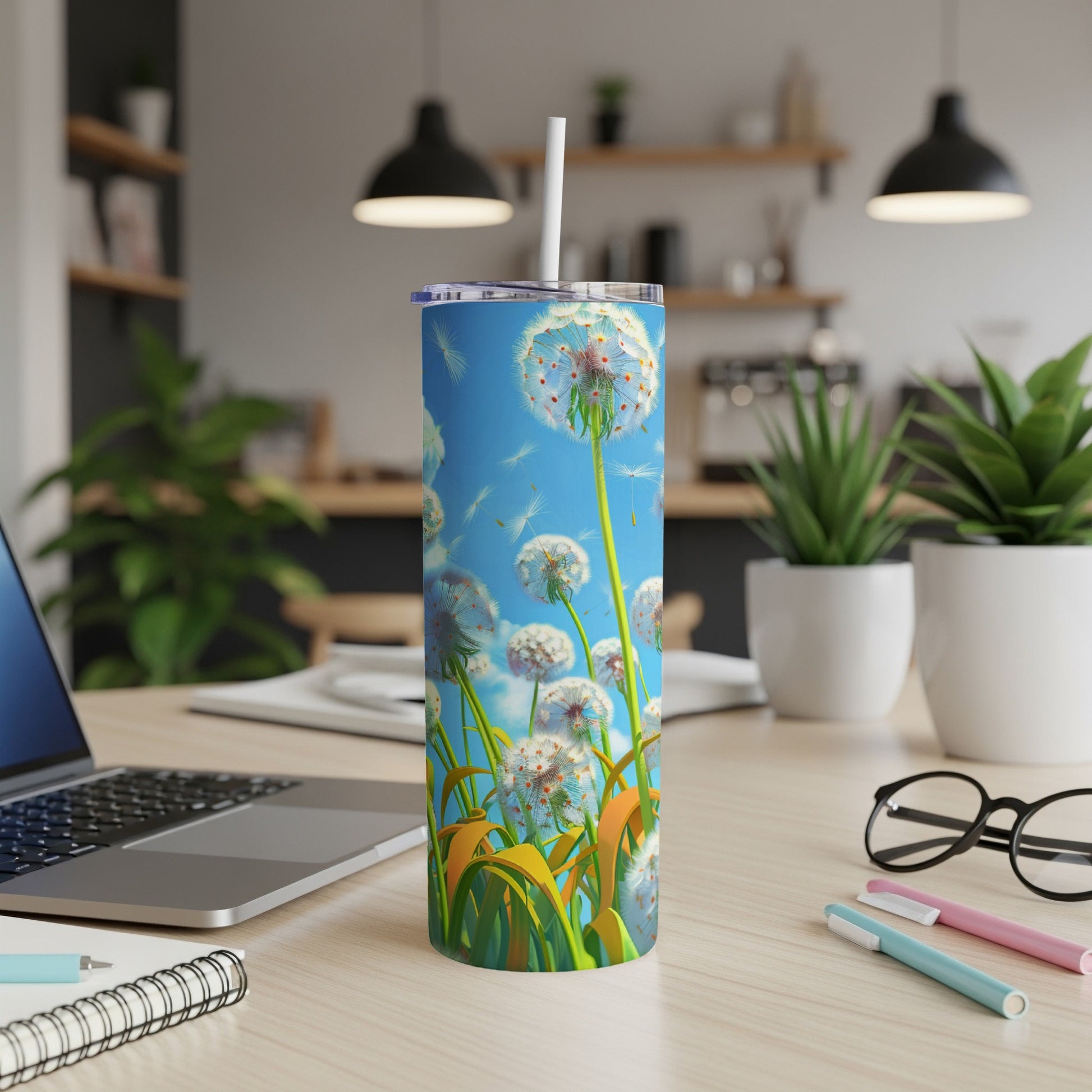 White dandelion puffs float on a blue sky above a patterned tumbler.