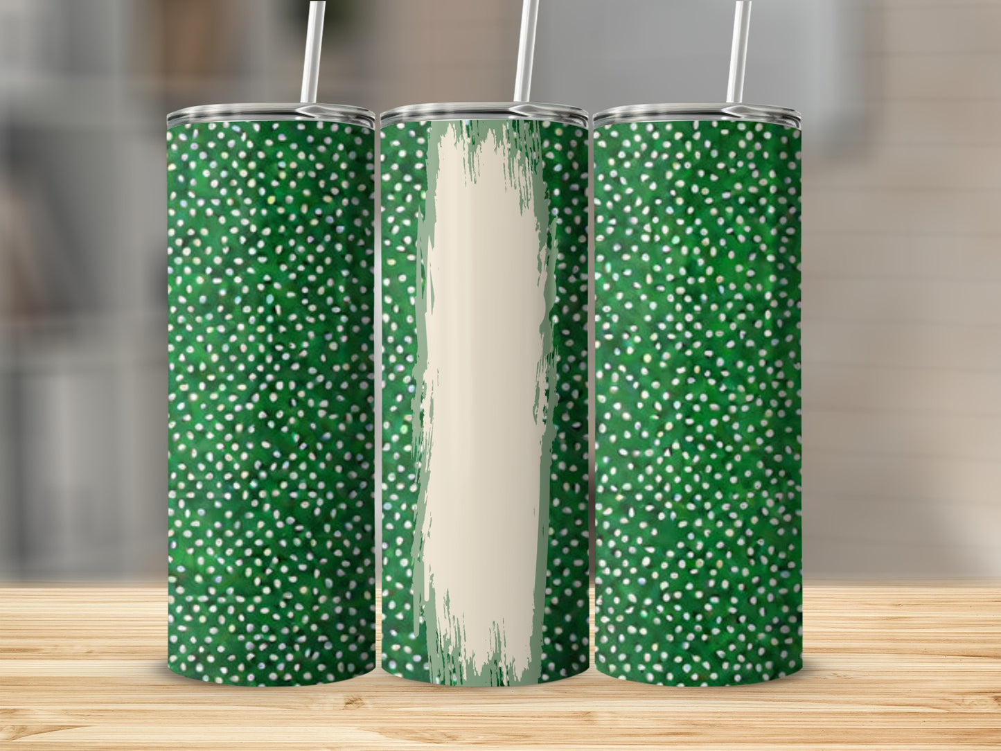Green speckled tumblers with a cream brushstroke design.