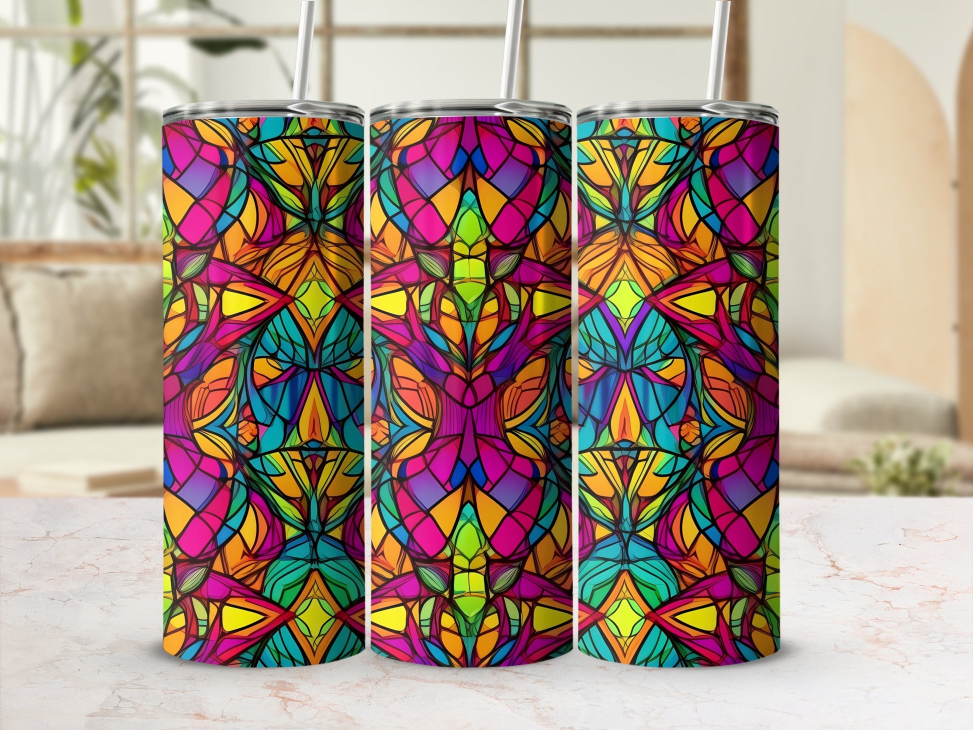 Three tall tumblers with a vibrant, stained-glass geometric pattern.