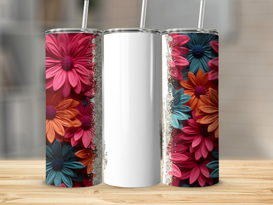 Three tumblers with colorful floral designs and glitter accents.