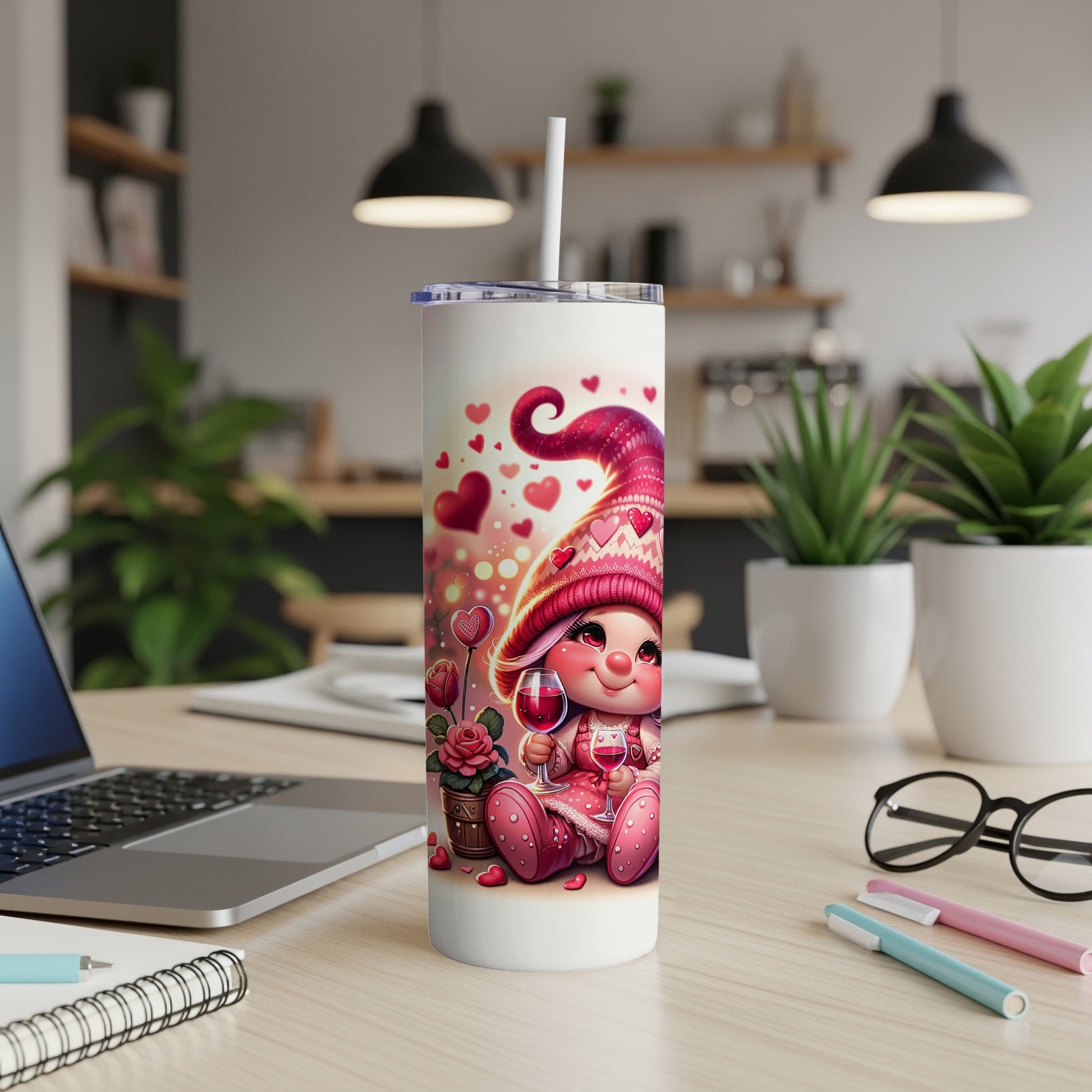 Pink gnome with hearts on a tumbler holding a glass of wine.