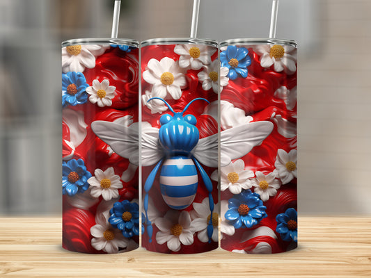 Three tumblers with blue and white striped bees and floral designs.