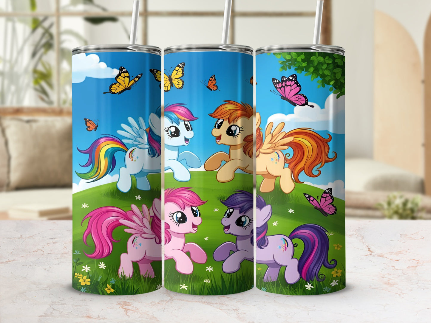 Three cartoon ponies with butterfly wings on a grassy hill under a blue sky.
