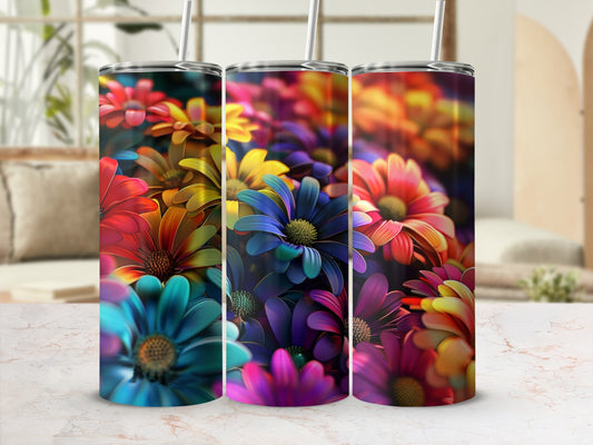 Three tumblers with colorful floral patterns on a marble surface.