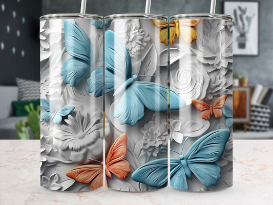 Three tumblers with embossed butterflies and flowers in blue and orange.