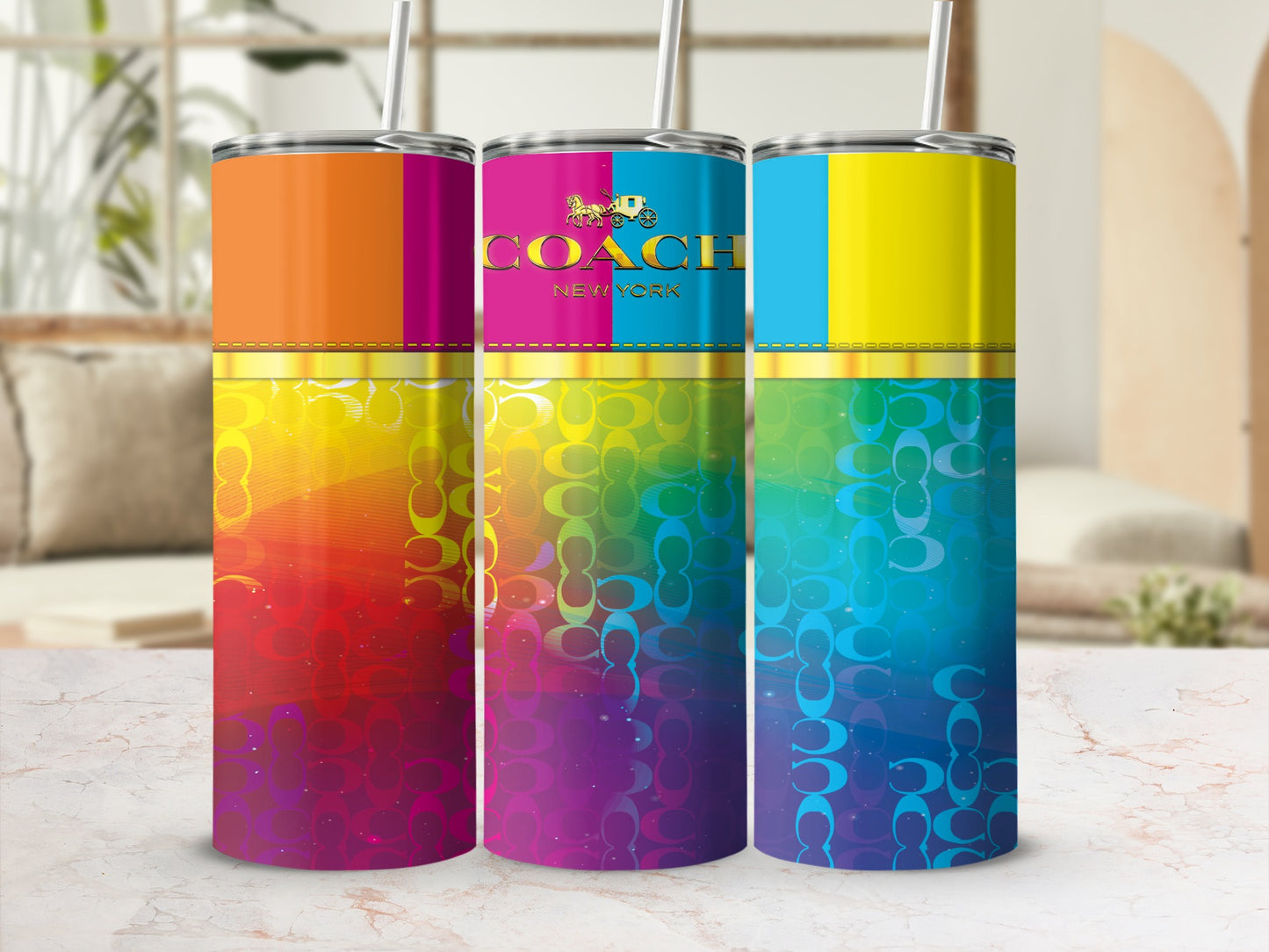 Three tumblers with rainbow ombre patterns and Coach logo on the middle tumbler.