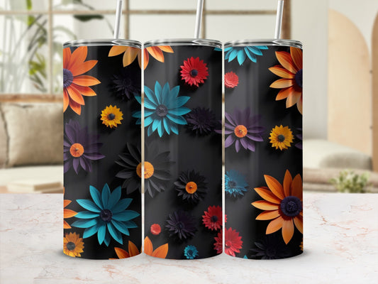 Three tumblers with a dark background and colorful floral designs.
