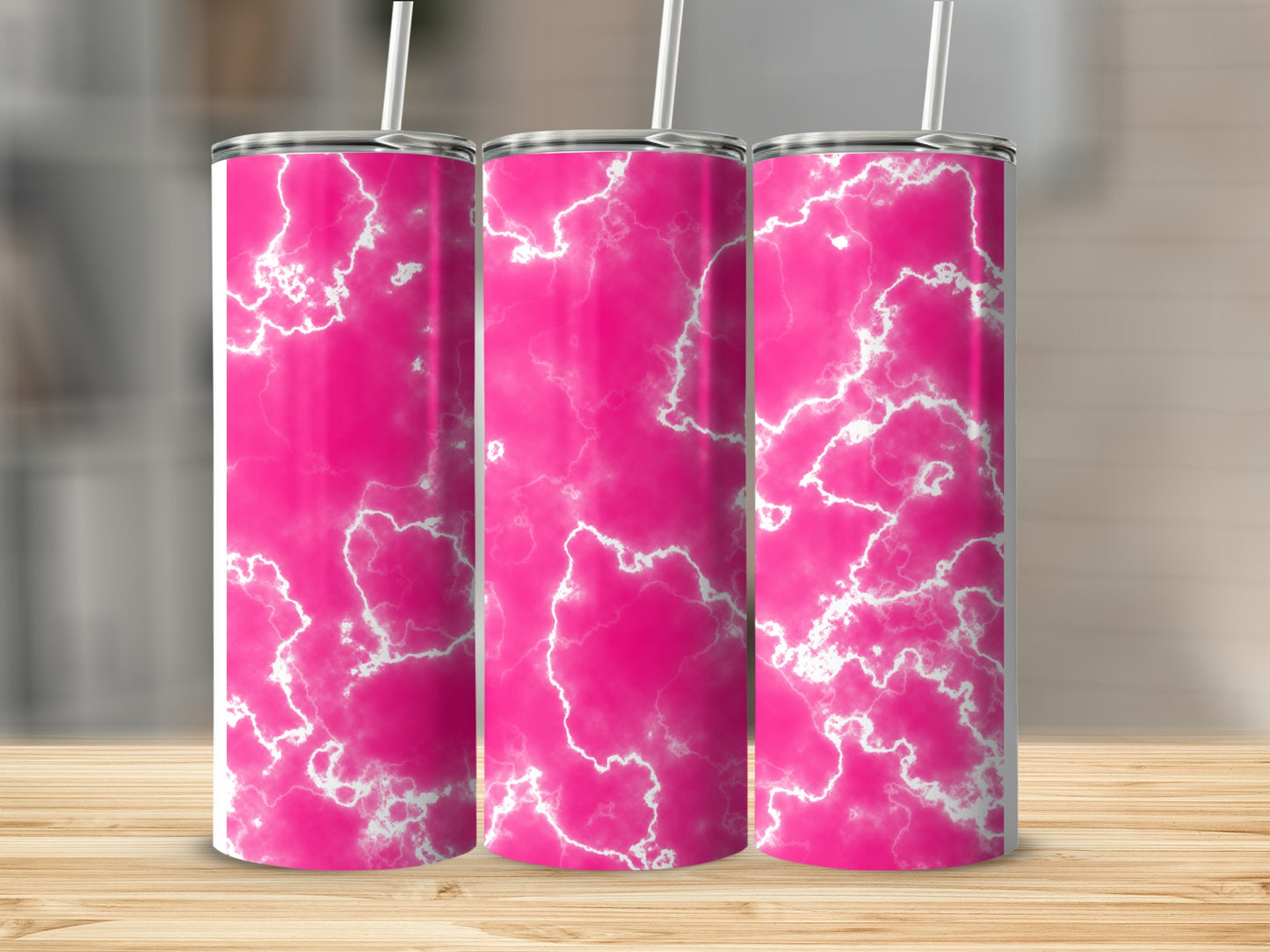 Three pink marbled tumblers with white lightning bolt patterns and straws.
