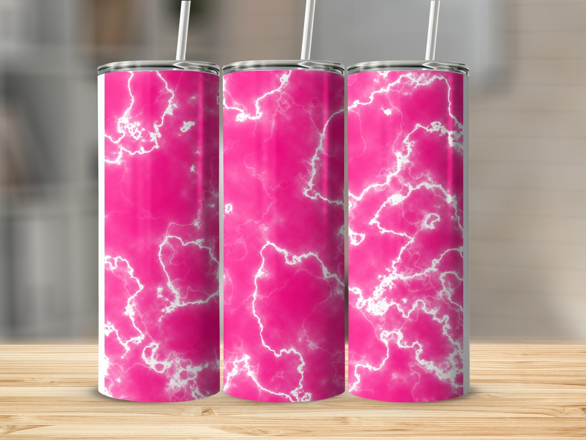Three pink marbled tumblers with white lightning bolt patterns and straws.
