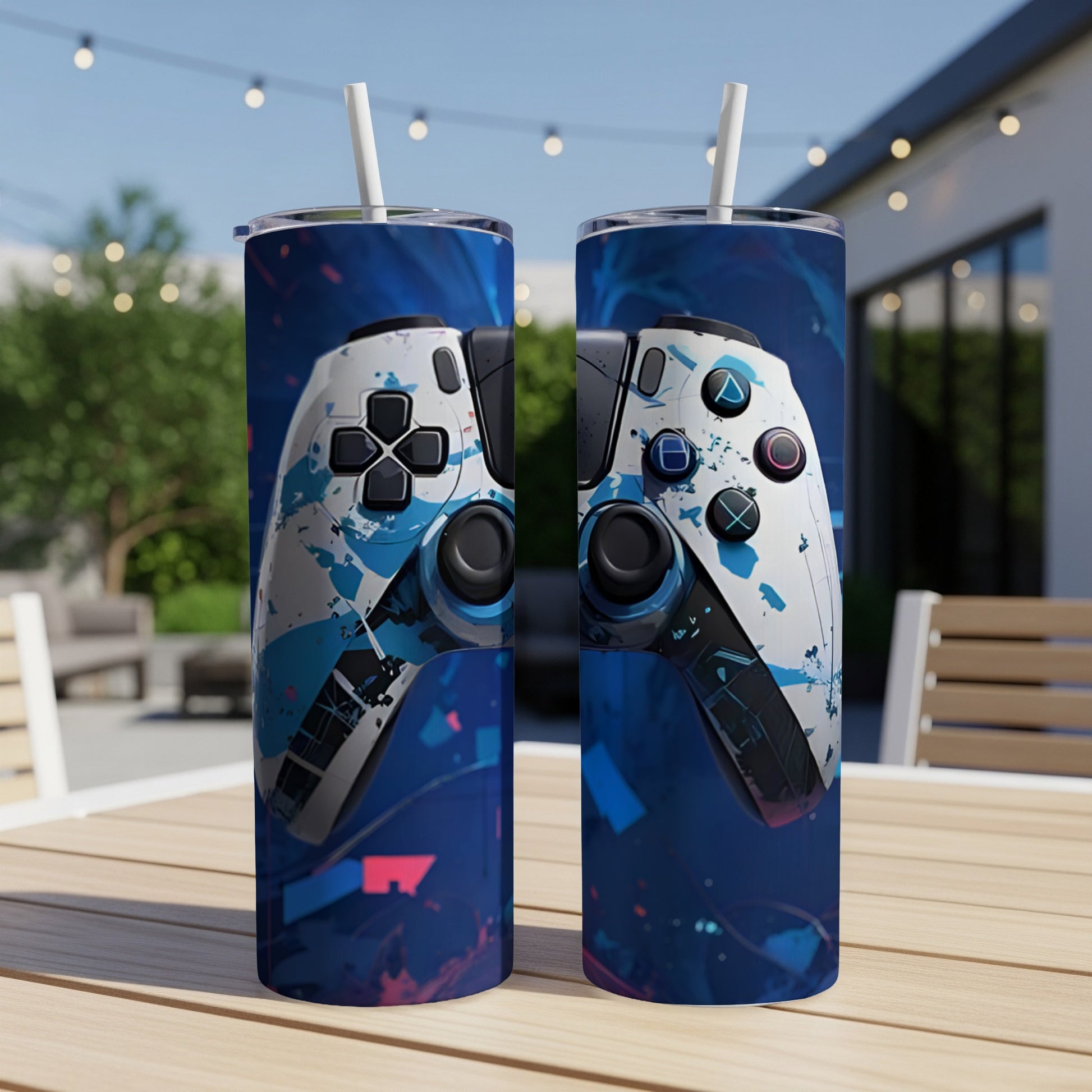 White video game controller with blue abstract paint splatters on a dark blue background.