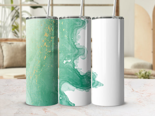 Three tumblers, two with green and gold abstract patterns, one blank.