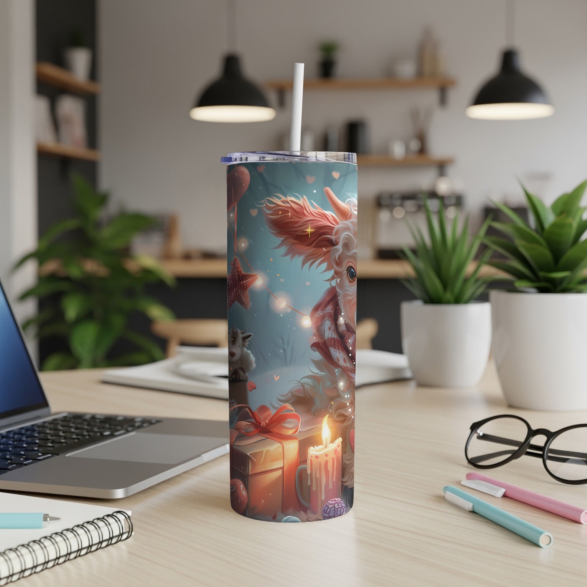 Festive Christmas tumbler with a character, gifts, and candle on a desk.