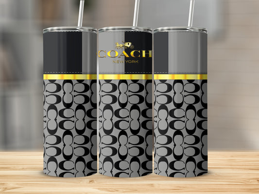 Coach New York tumblers with repeating C logo pattern and gold accents.