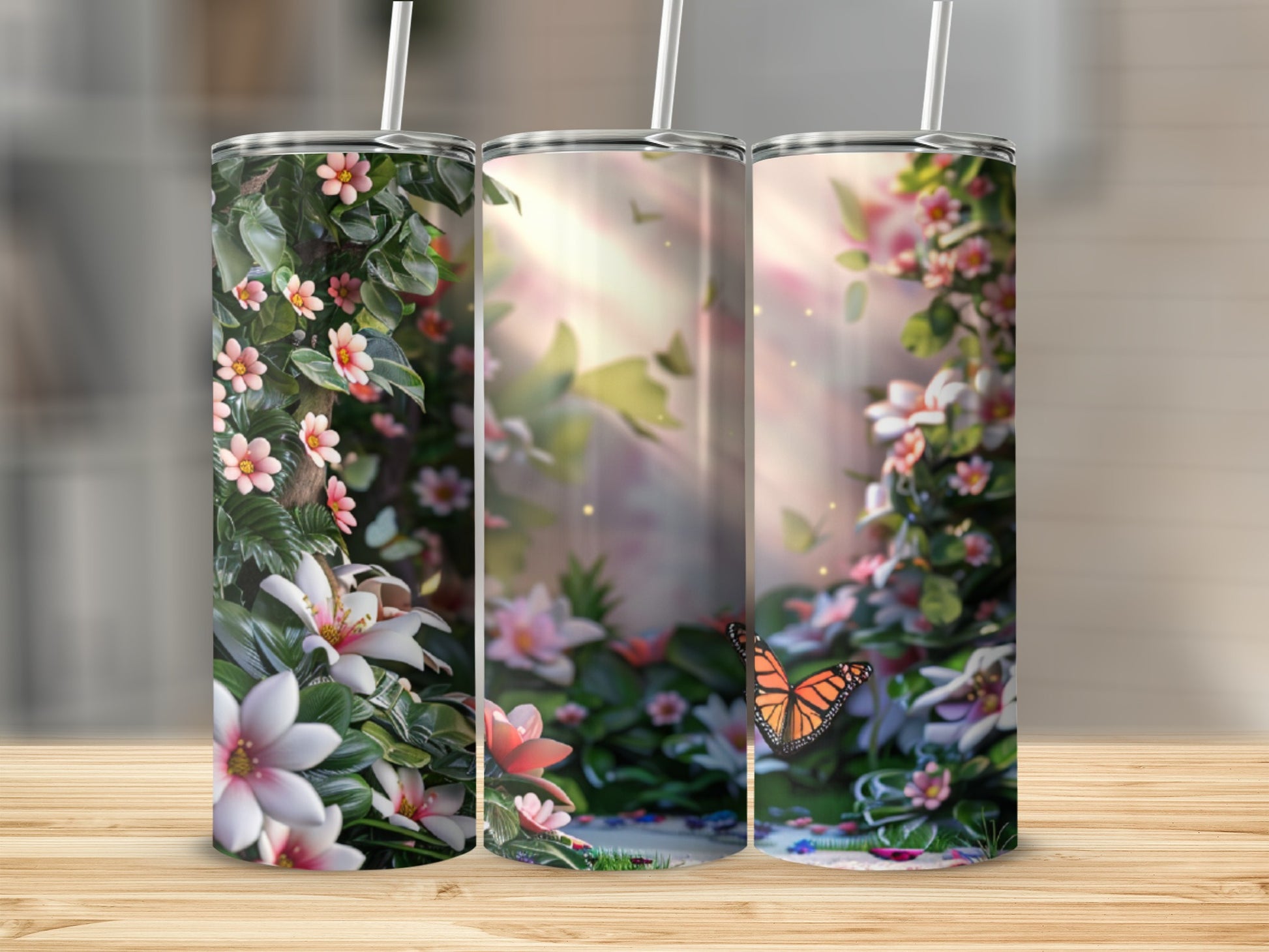 Three tumblers featuring a whimsical floral and butterfly garden scene.