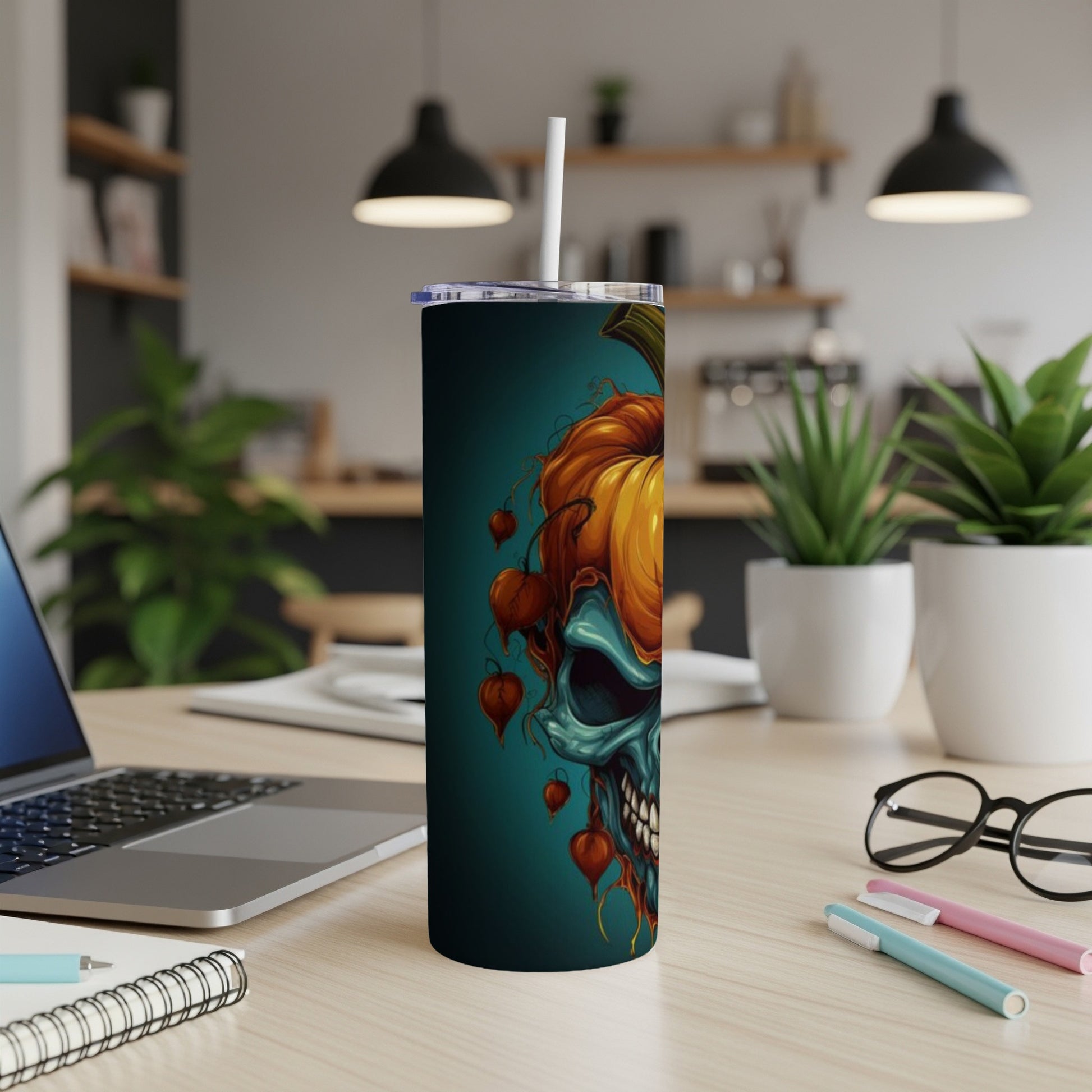 Tall tumbler featuring a half skull, half pumpkin Halloween design.