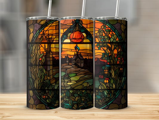 Three stained glass tumblers with a Halloween scene of a house and pumpkin.