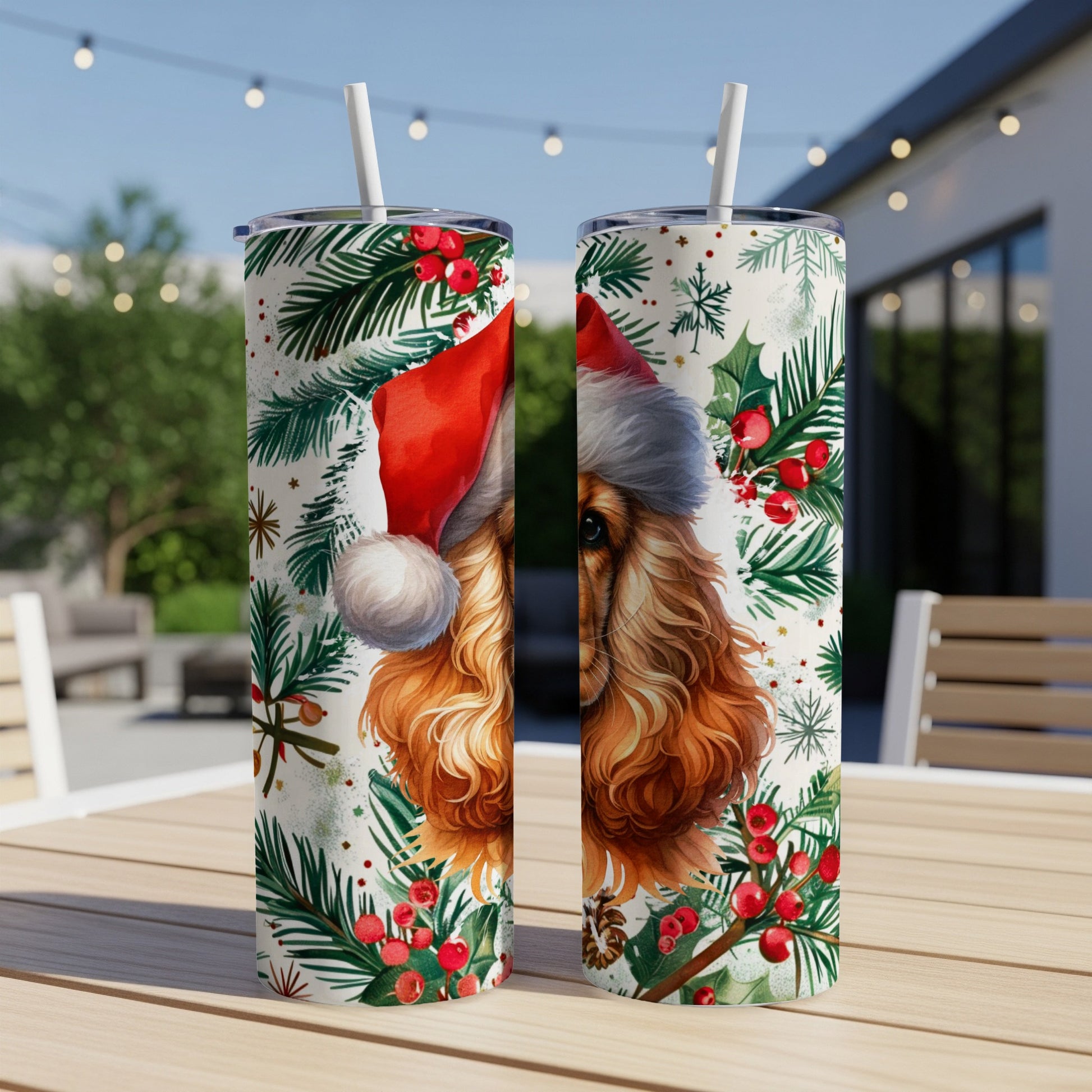 Two tumblers with a Christmas-themed cocker spaniel design and green foliage.