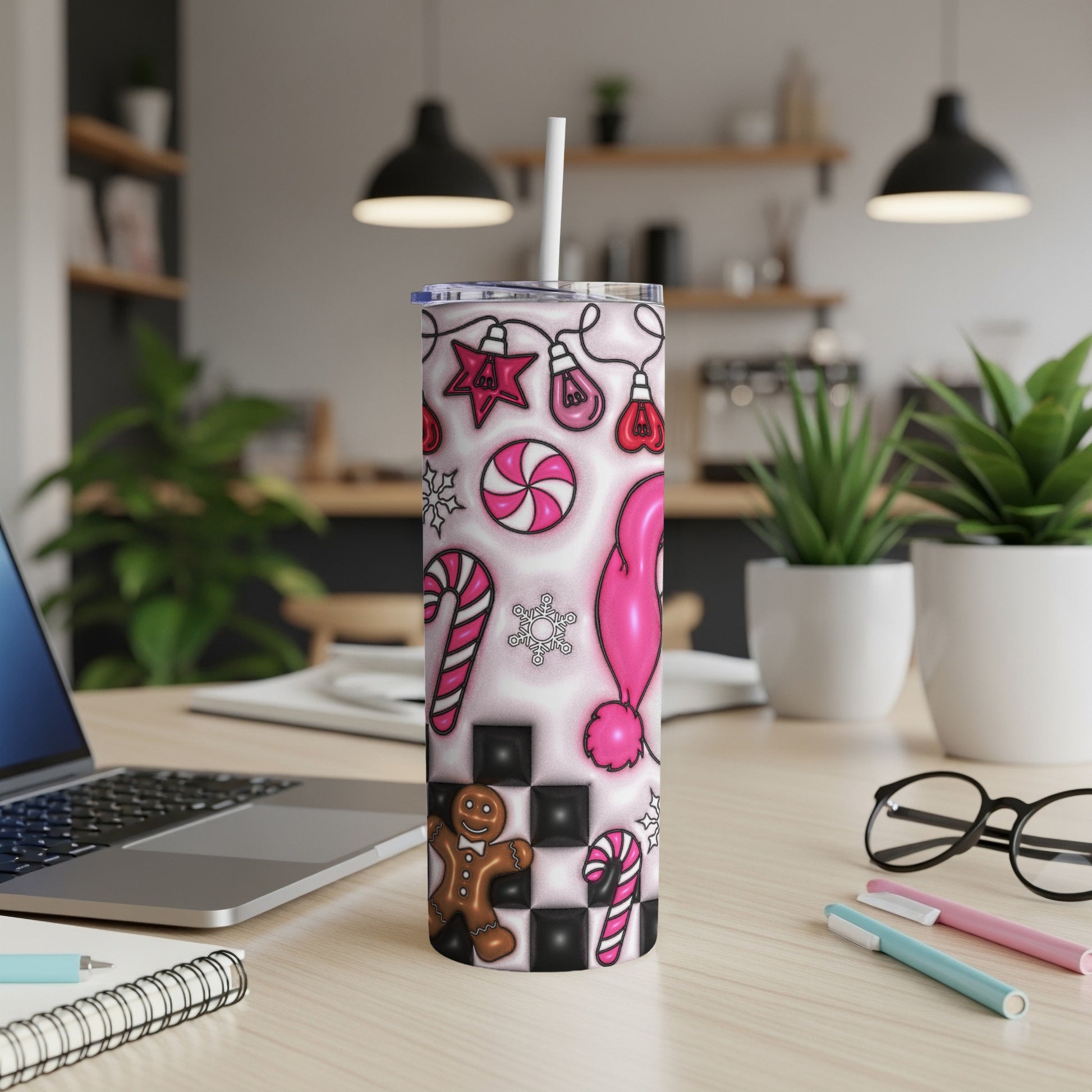 Pink Christmas tumbler with gingerbread man, candy canes, and festive lights.