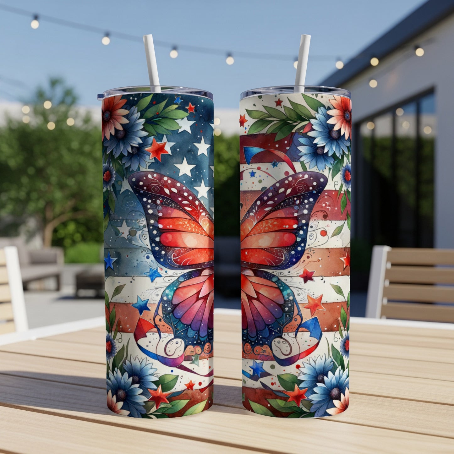 Two tumblers with patriotic butterfly and floral design on a table.