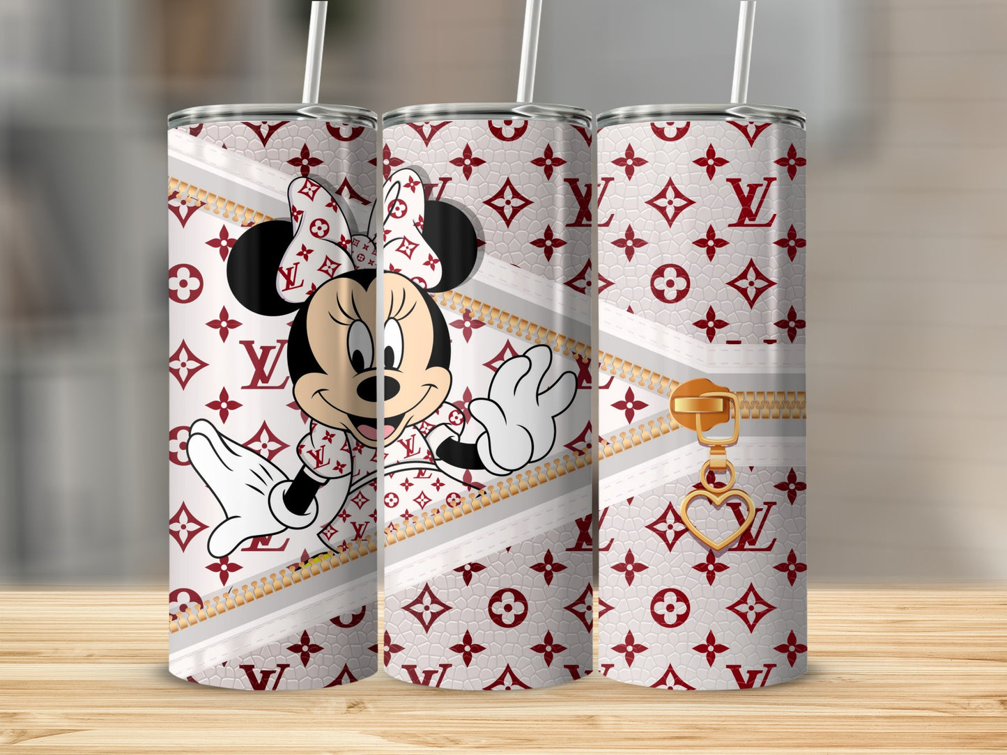 Minnie Mouse on a patterned tumbler with a gold zipper and heart charm.