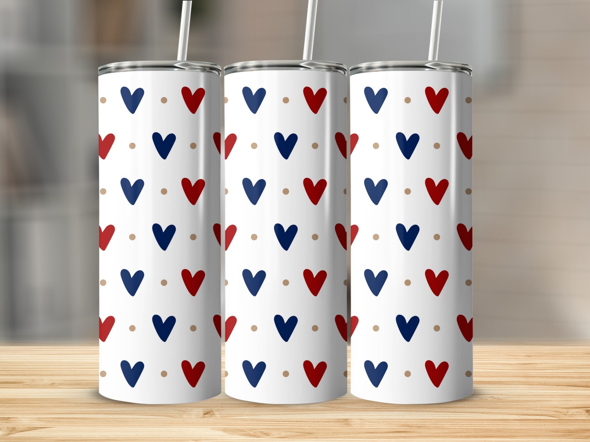 Three white tumblers with a pattern of red and blue hearts.