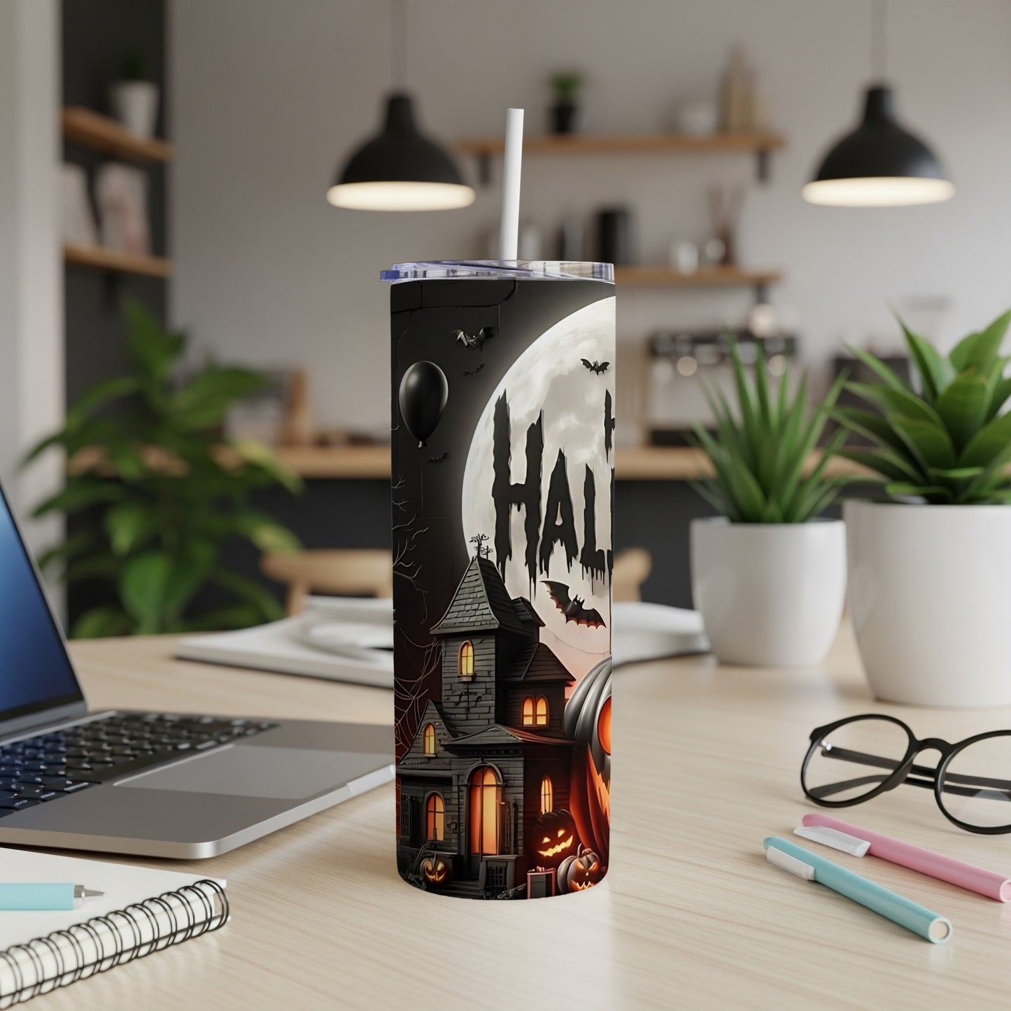 Tumbler with haunted house, pumpkins, bats, balloon, and full moon with "HALLOW" text.