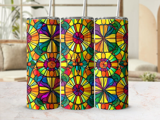 Three stained glass tumblers with colorful geometric patterns.
