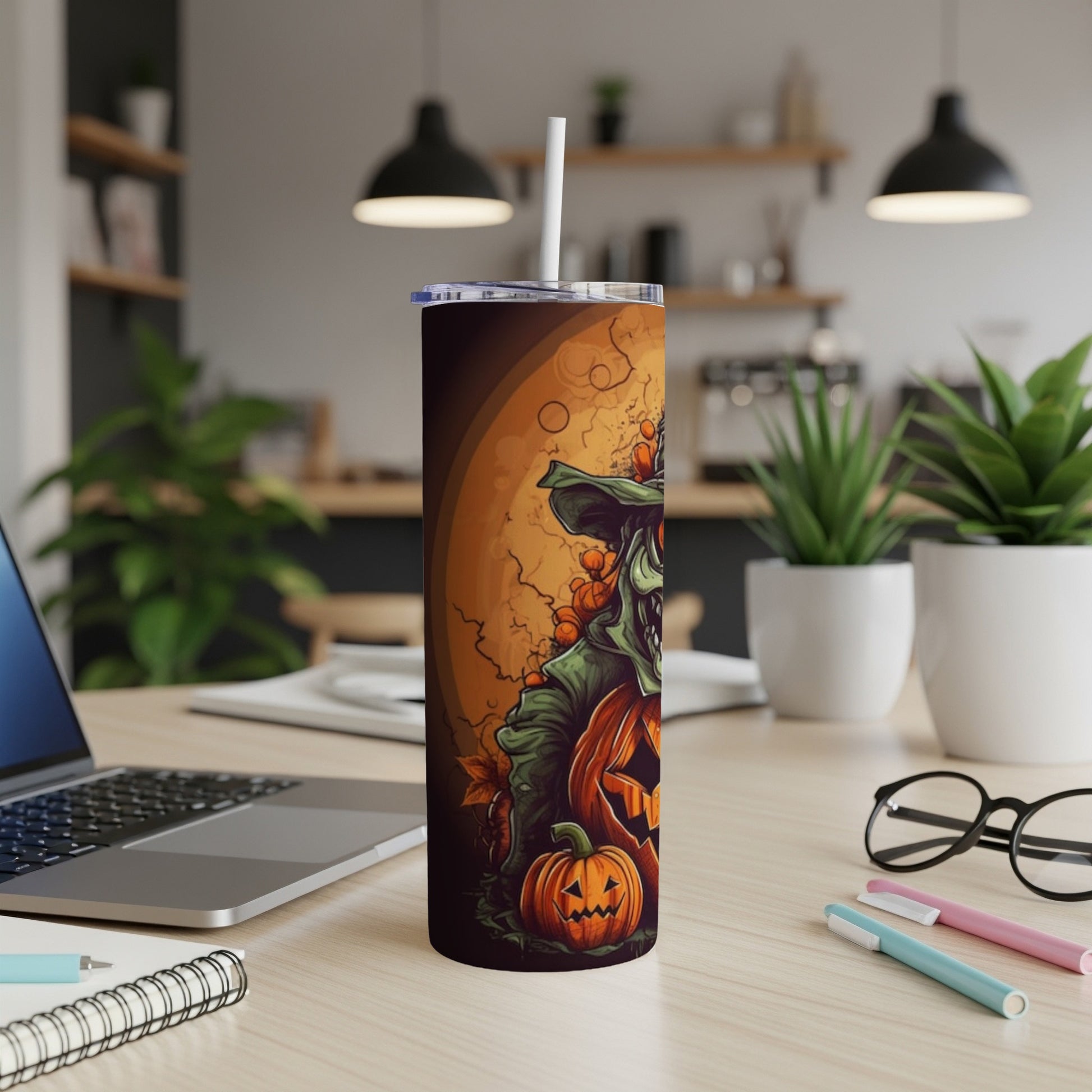 Halloween tumbler with scarecrow and pumpkins design and a straw.