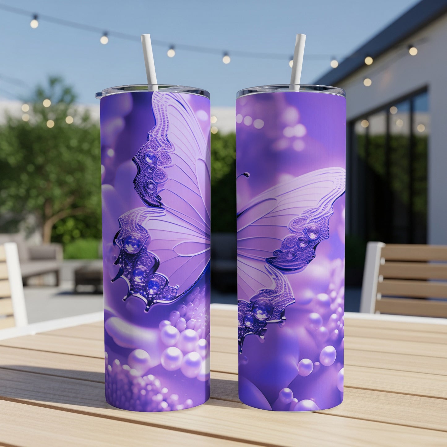 Purple butterfly design on two tumblers with straws.