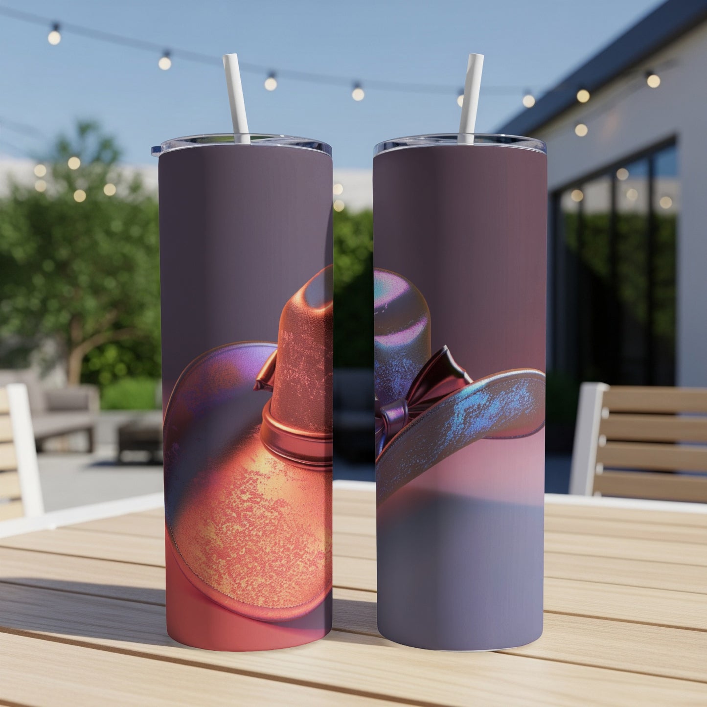 Two tall tumblers with a shimmering cowboy hat design in purple and orange hues.