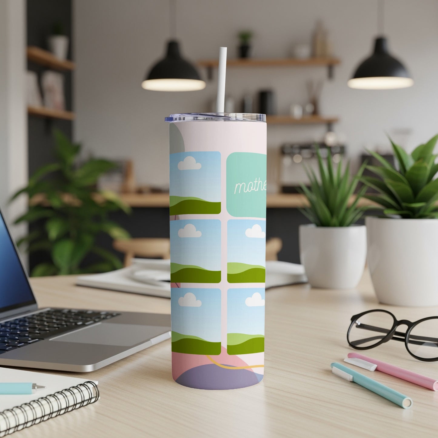 Tall tumbler with a colorful abstract design and "mother" text, set on a desk.