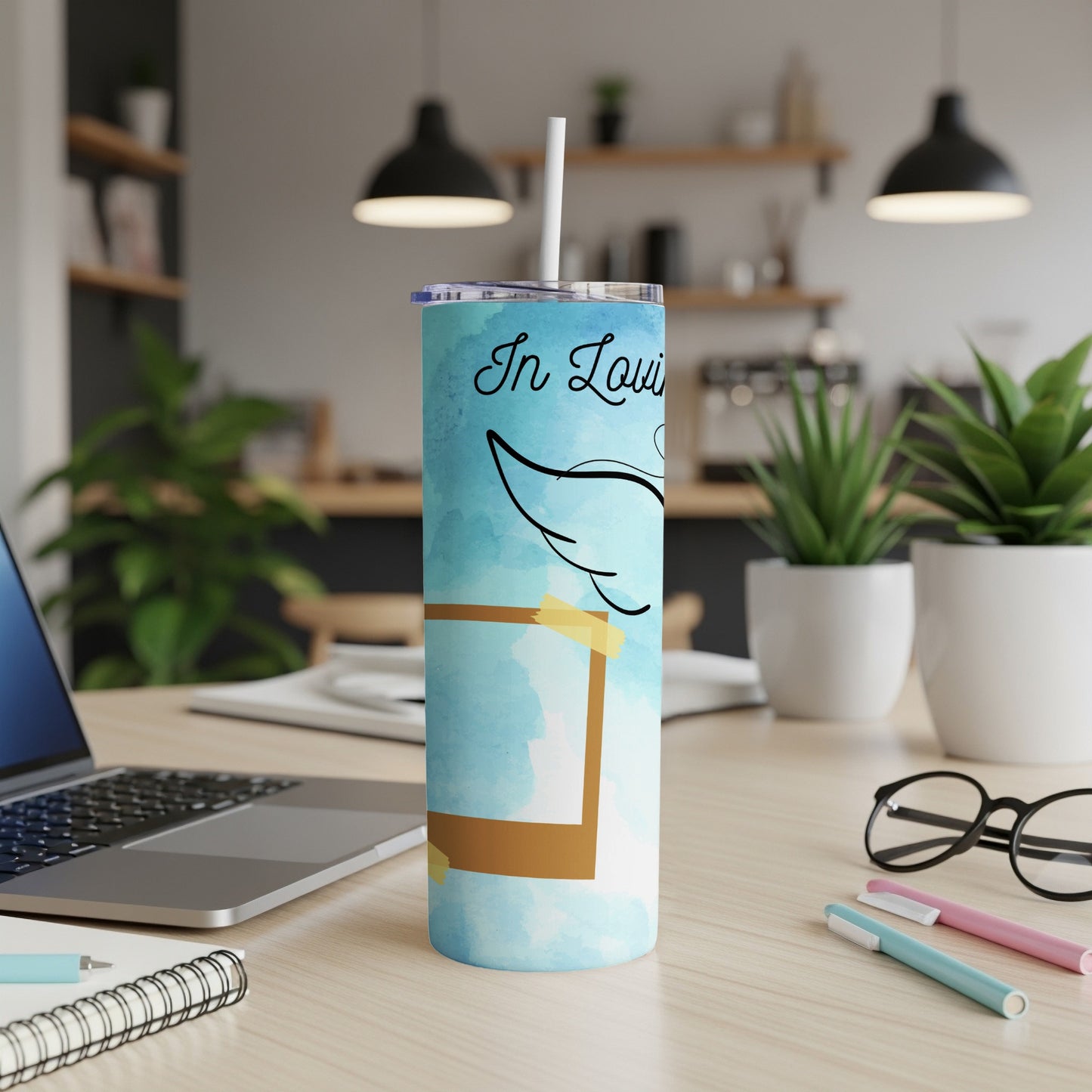 Blue tumbler with "In Loving Memory" and angel wings on watercolor background.