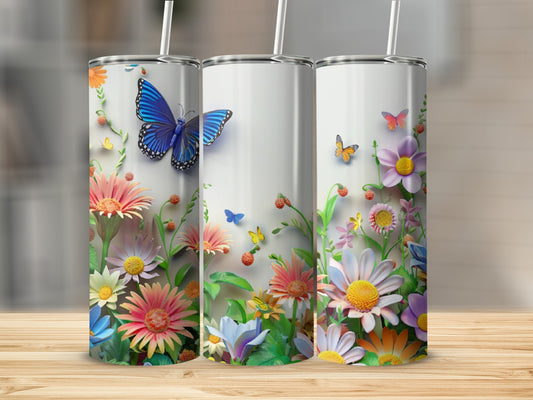 Three tumblers featuring colorful flowers and butterflies against a white background.