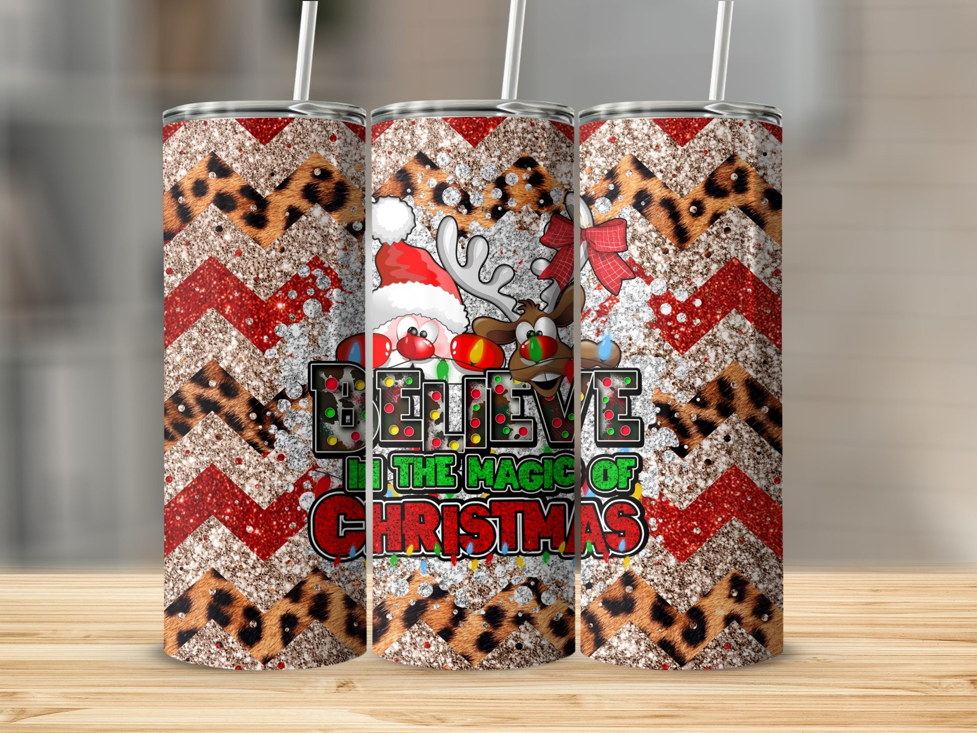 Christmas tumbler with Santa, reindeer, and "Believe in the magic of Christmas" text.