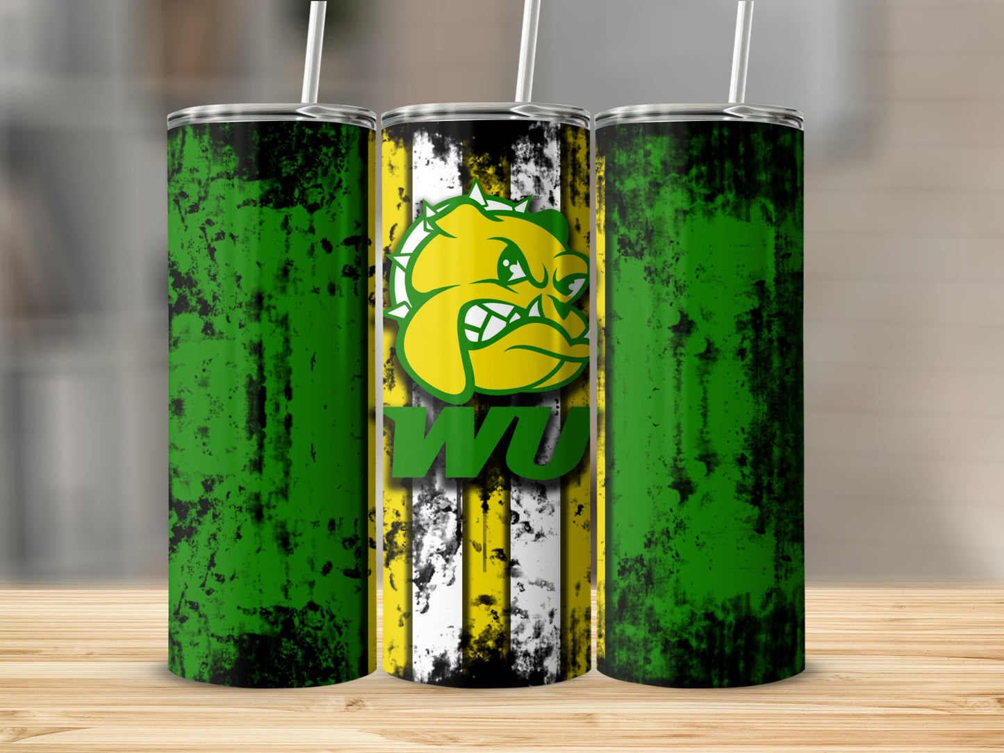 Three tumblers with distressed green designs and a middle tumbler featuring a caricature and "WU" text.