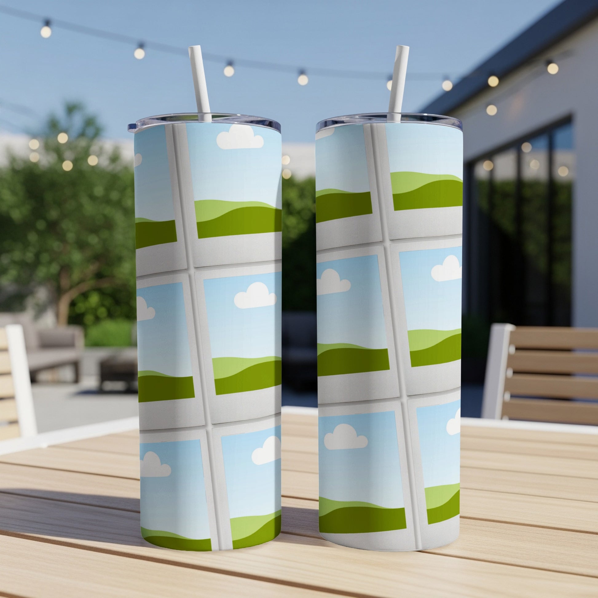 Two tumblers with a repeating pattern of polaroid-style photos of green hills and blue sky.
