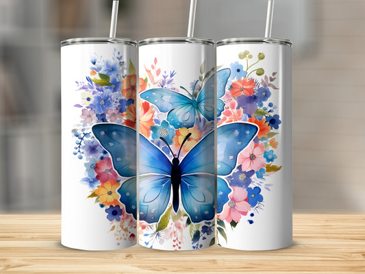 Three tumblers with watercolor blue butterflies and floral designs.