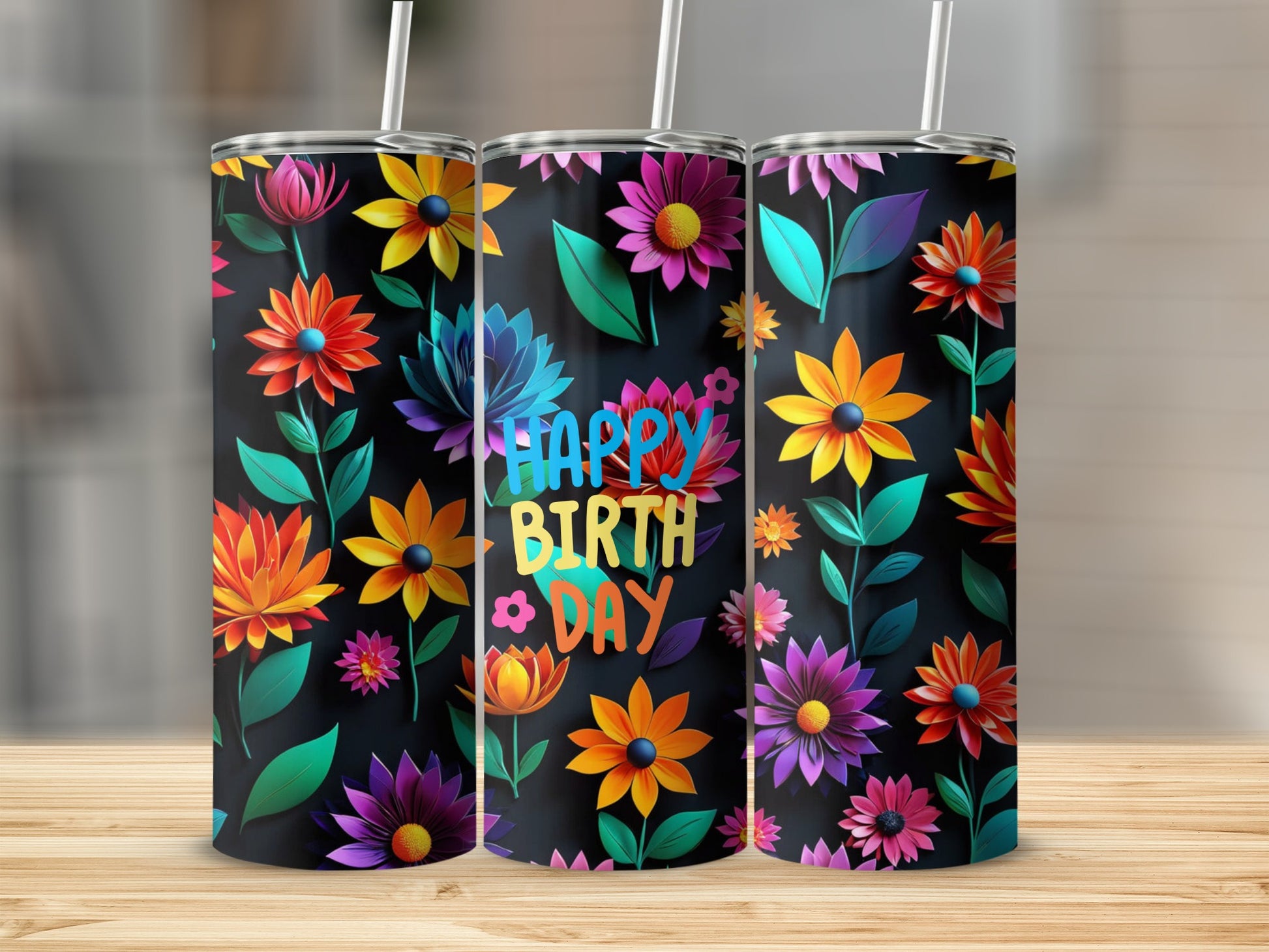 Three tumblers with colorful floral designs and "Happy Birthday" text.