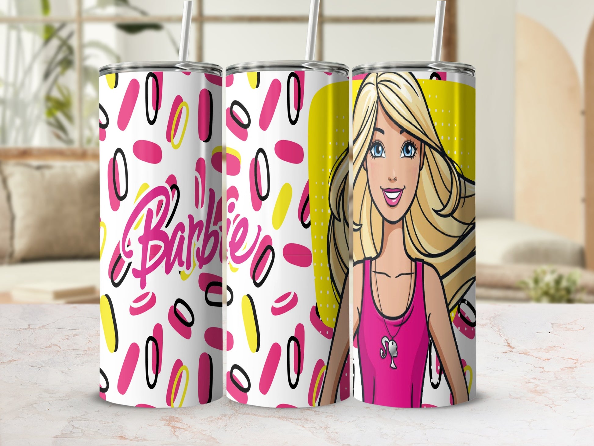 Barbie tumbler with pink and yellow oval pattern and Barbie's face.
