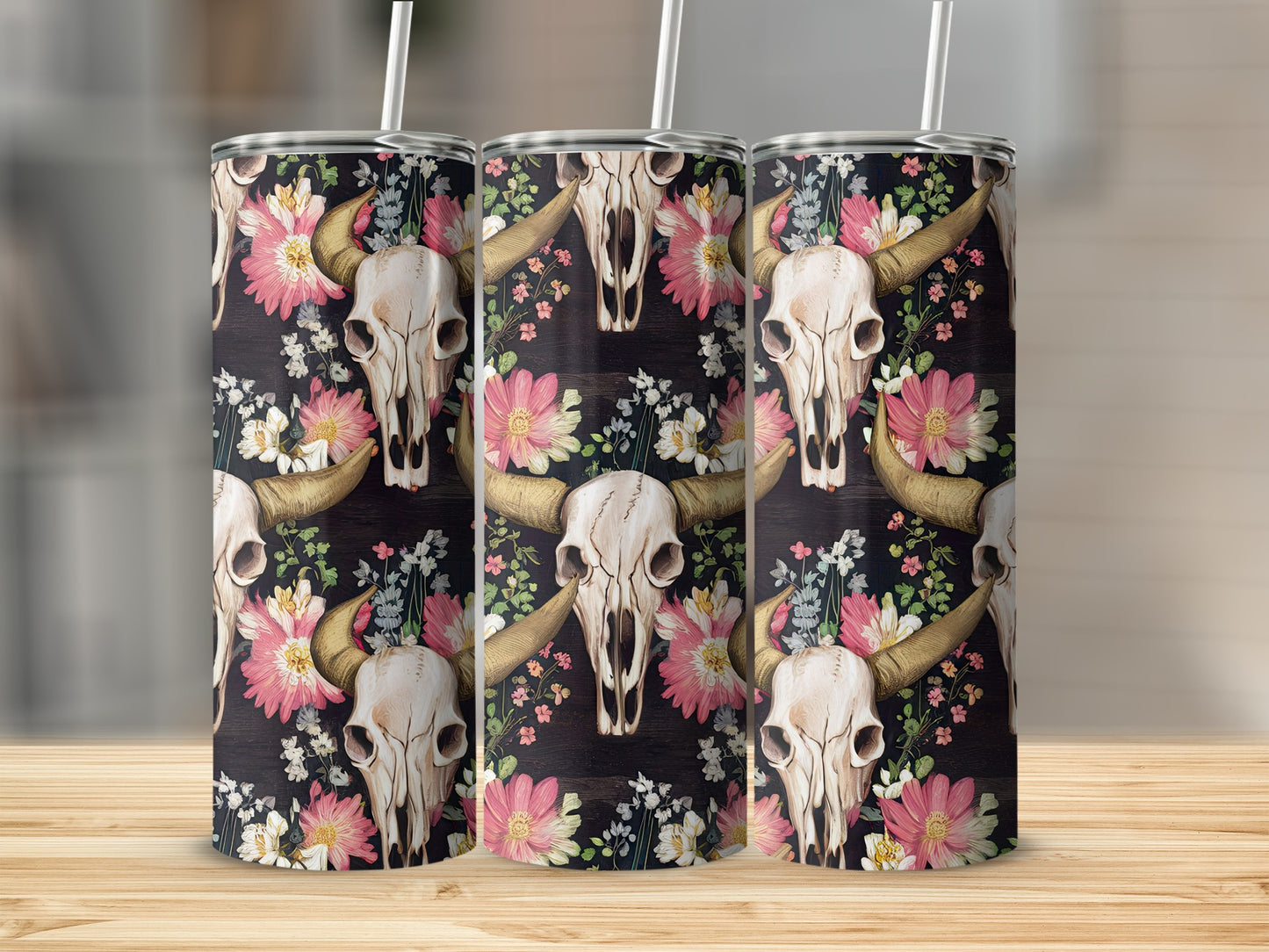 Floral skull pattern on a tumbler with a straw.