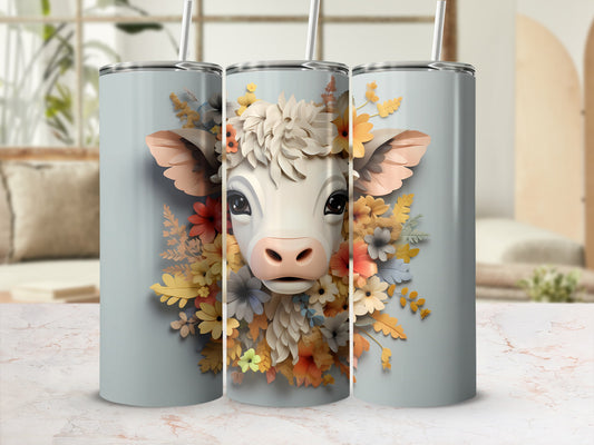 Three tumblers featuring a cow surrounded by colorful flowers.