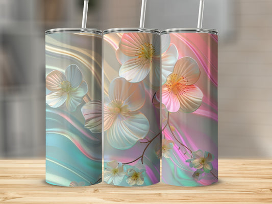 Three floral tumblers with pastel iridescent backgrounds and white straws.