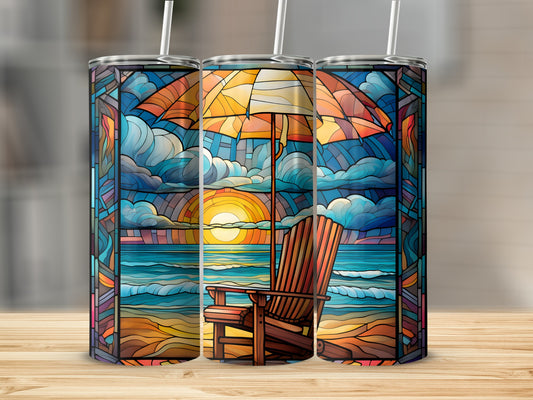 Beach scene with Adirondack chair and umbrella on stained glass tumbler.