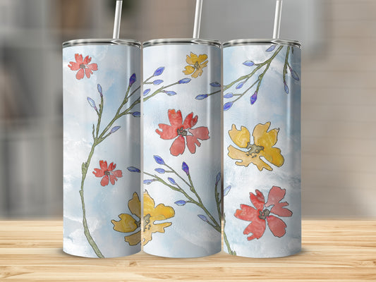 Three floral tumblers with watercolor flowers and branches on a light blue background.