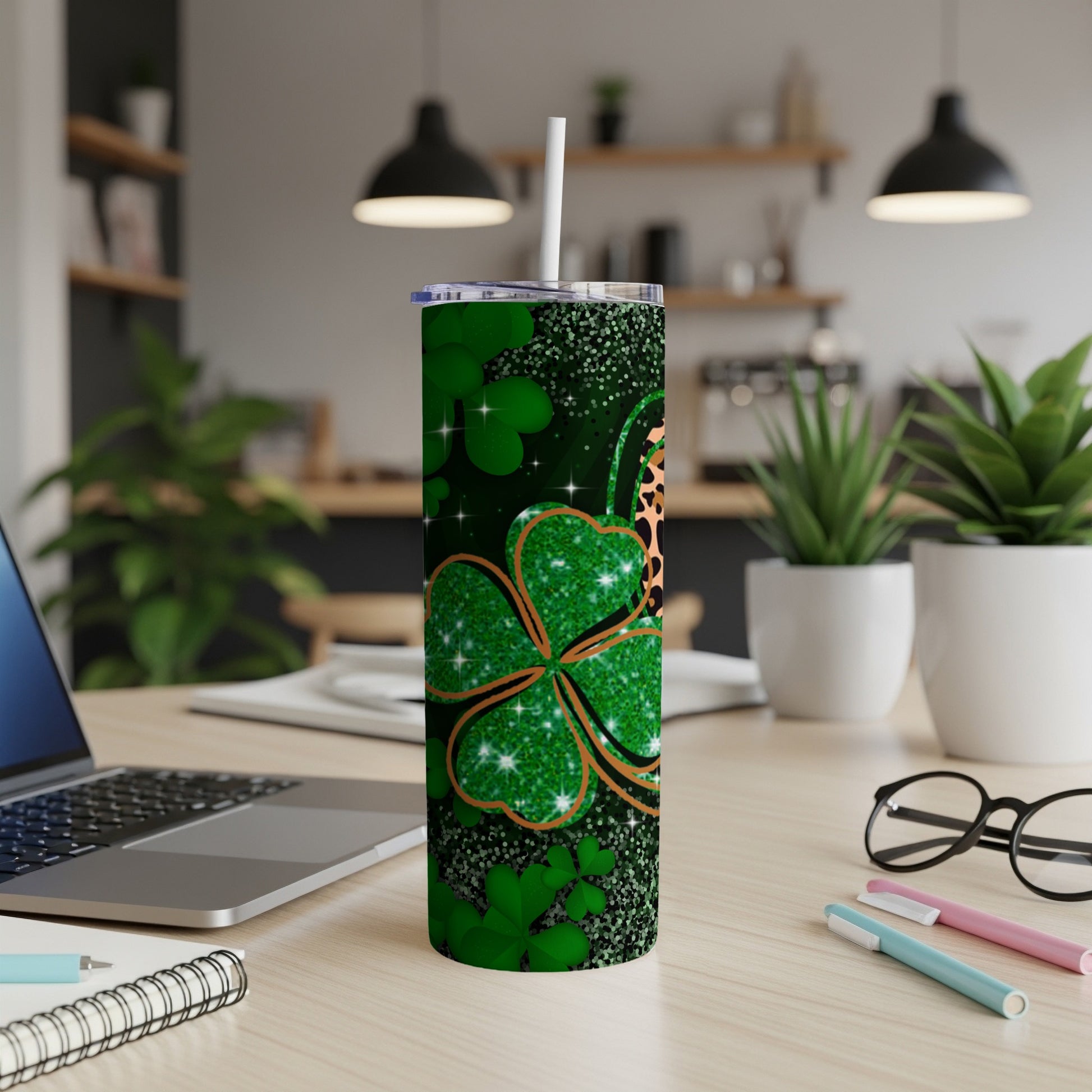 Green clover tumbler with leopard print detail and straw.