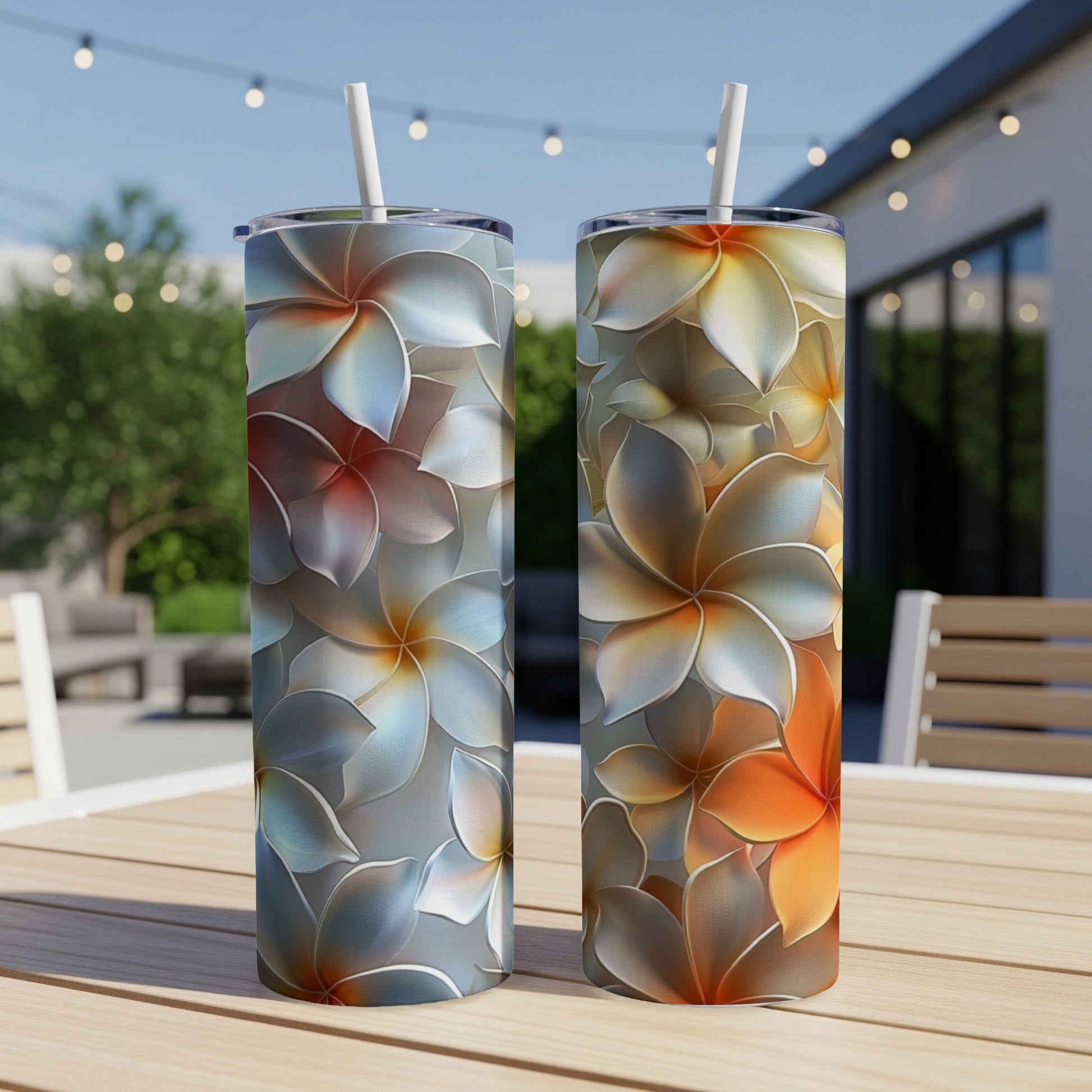 Two tumblers with floral patterns, one blue and one orange.