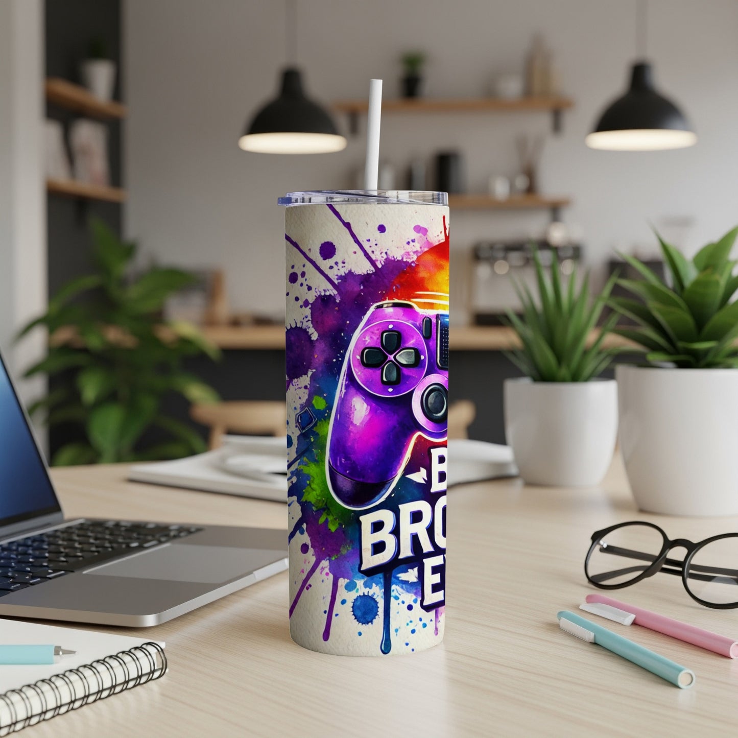 Purple video game controller with colorful paint splatters on a tumbler.