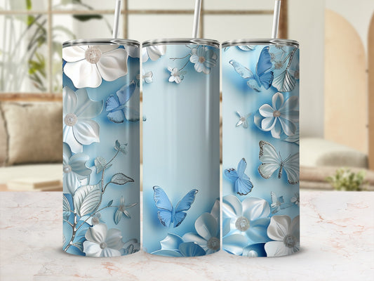 Three light blue tumblers with floral and butterfly designs.