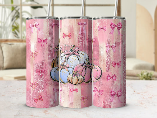 Pink distressed background with scattered bows and a cluster of decorative pumpkins.