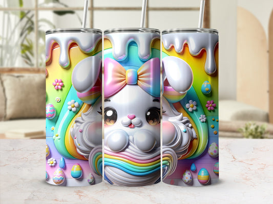 Easter bunny tumbler with rainbow drips and floral accents.